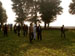 Students walking to a nearby field to see a live demo of Sweet Clover and Mustard harvesting using an older Italian machine.