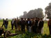 Students watching a live demo of Sweet Clover and Mustard harvesting using an older Italian machine.